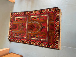 red and brown rug